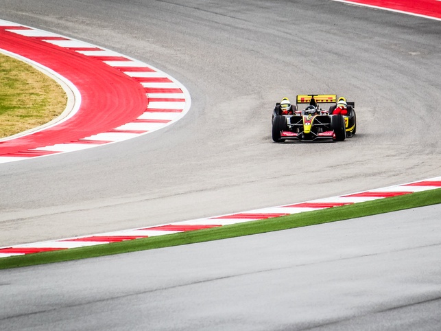 formula 1 ride along coming out of a turn for Ride Drive Give promotion
