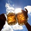 toasting with beer mugs with sky in background
