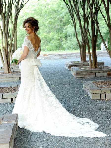 News_Sachse-Florescu wedding_May 2012_bride_in garden_from back
