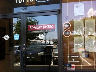 Front doors of bombay bistro located at the arboretum in austin, tx.