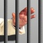 Dr. Michael Brown, behind bars, in jail