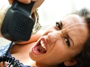 woman mad and swearing while on the phone