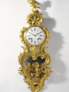 Clock movement by Jean-Romilly, French, 1714-1796 Case attributed to Charles Cressent, French, 1685-1768 Bracket by Jean-Joseph de Saint-Germain, French, 1719-1791 Clock on Bracket (Cartel sur une console) c. 1758 Gilt bronze, enameled metal; glass