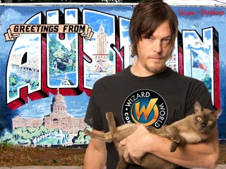 Wizard World Austin Comic Con promo photo of Norman Reedus holding a cat