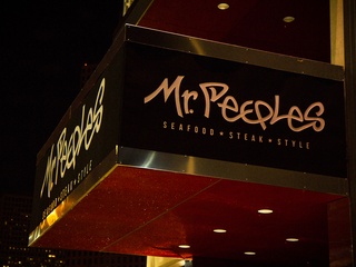 Mr. Peeples Houston restaurant exterior sign at night