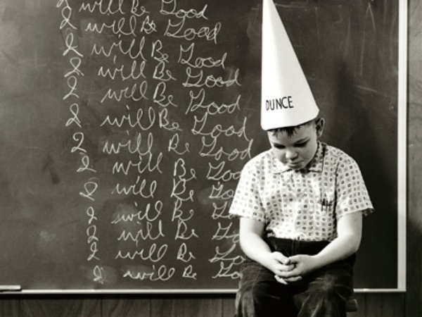 Student in dunce cap