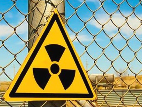 radioactive sign, chain-link fence