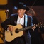 George Strait, with guitar, smiling