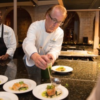 Robert Del Grande in kitchen at Recipe for Success dinner