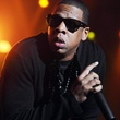 Jay-Z, with mic, sunglasses