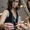 Margot Wolf shows on of her pieces to fellow artist Cambria