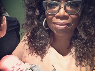 Oprah WInfrey with Caswell baby at Reef