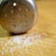 salt, spilled salt, salt shaker