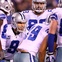 The Cowboys huddle together on offense