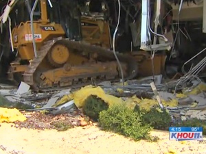 bulldozer, building, disgruntled employee, Ritchie Bros auction house