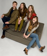 Von Trapp family on the couch
