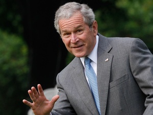 George W. Bush, waving, smiling