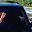 News_couple_kissing_car_foot