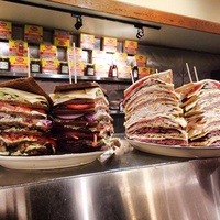 Kenny & Ziggy's giant deli sandwiches on counter