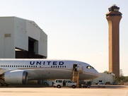 United Dreamliner airplane at IAH with control tower