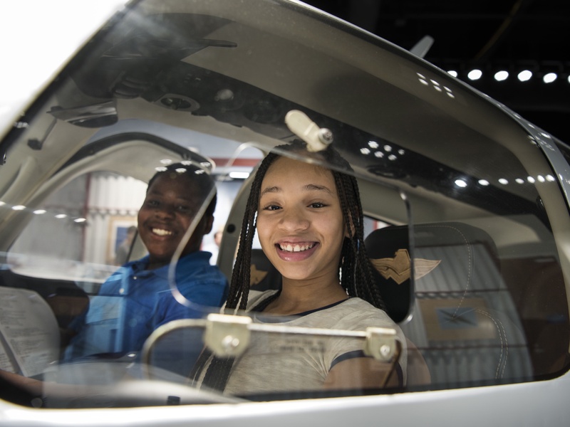 Lone Star Flight Museum visitors in cockpit of airplane