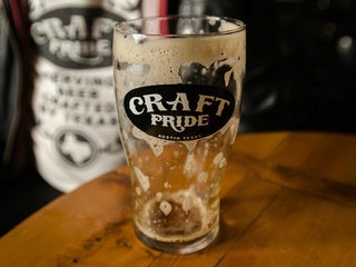 Craft Pride beer brew empty glass Austin bar Rainey Street