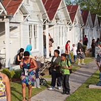 Project Row Houses with people walking outside day