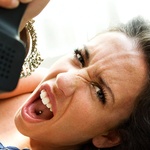 woman mad and swearing while on the phone