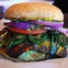 Cheeseburger with bacon and jalapeños at Maple & Motor in Dallas