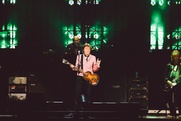 Paul McCartney at the Frank Erwin Center making the longhorn sign